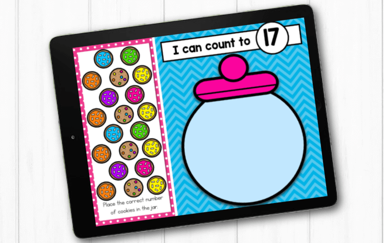 Students practice number recognition and counting by placing the correct number of cookies in the cookie jar.